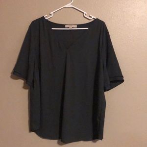 Dark gray blouse with flares sleeves.